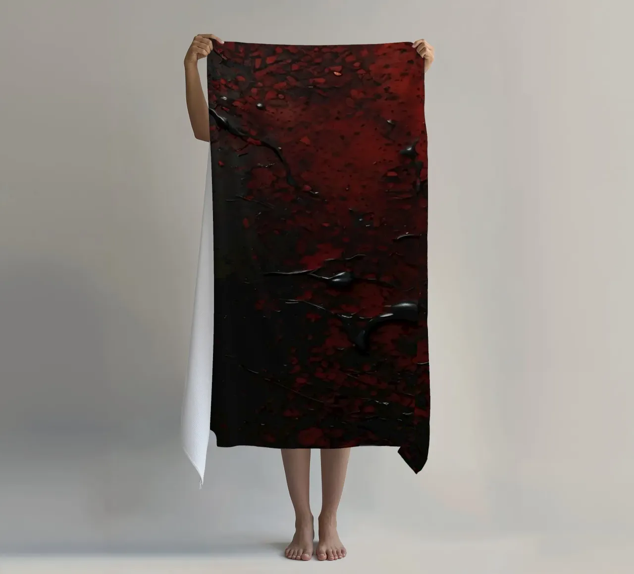 Abstract texture with black and red paint splashes on a dark beach towel by DesignDoodle