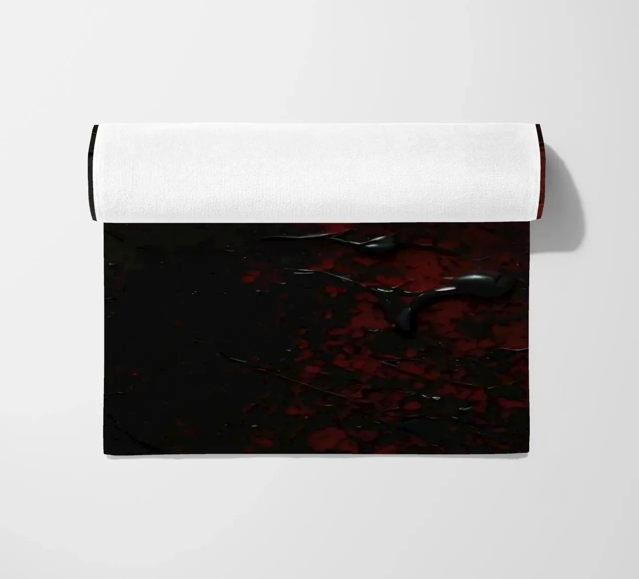 Abstract texture with black and red paint splashes on a dark beach towel by DesignDoodle