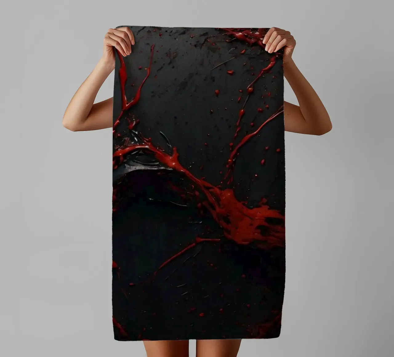 Vivid red paint splatter creates abstract design a dark towel by DesignDoodle