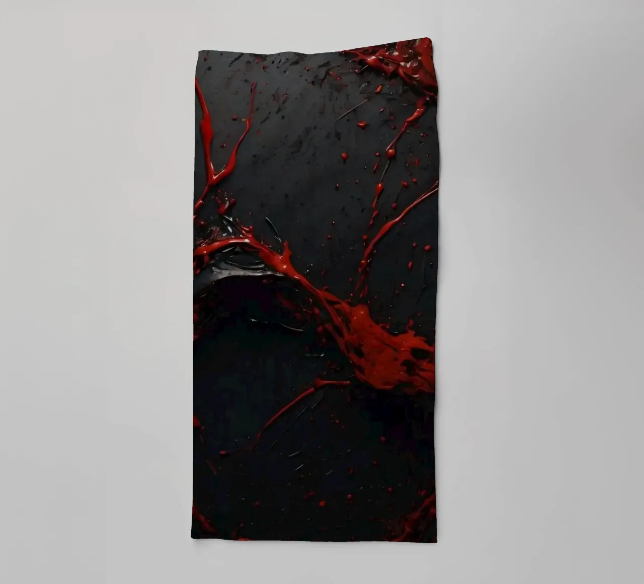 Vivid red paint splatter creates abstract design a dark towel by DesignDoodle