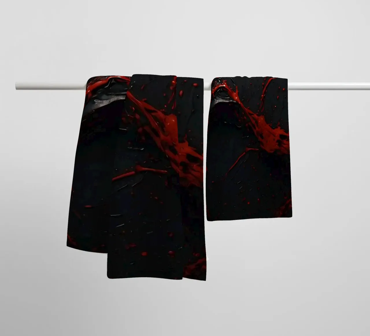 Vivid red paint splatter creates abstract design a dark towel by DesignDoodle