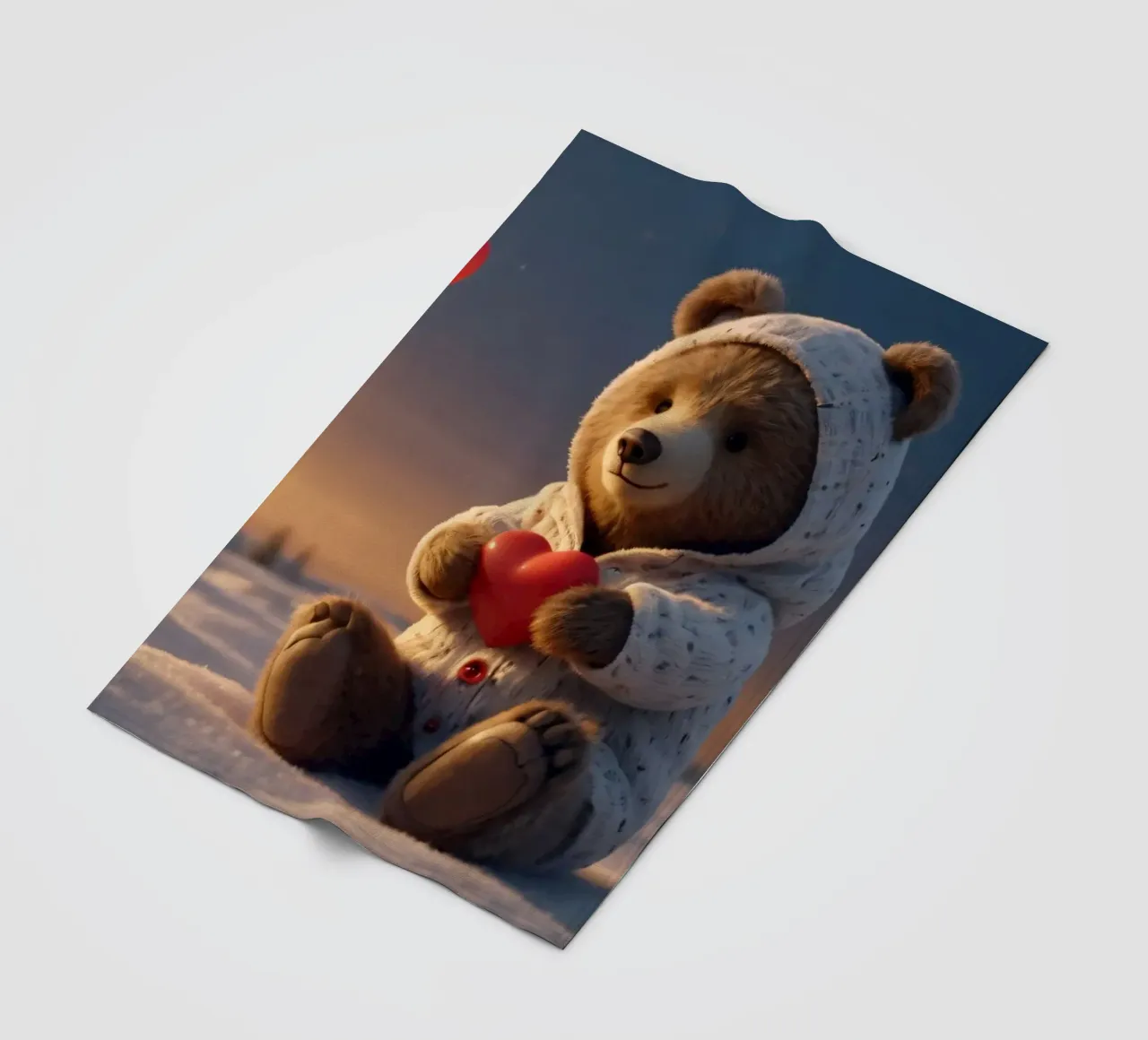 Un orsacchiotto con un'accogliente felpa con cappuccio stringe un cuore in una terra invernale coperta in pile da DesignDoodle