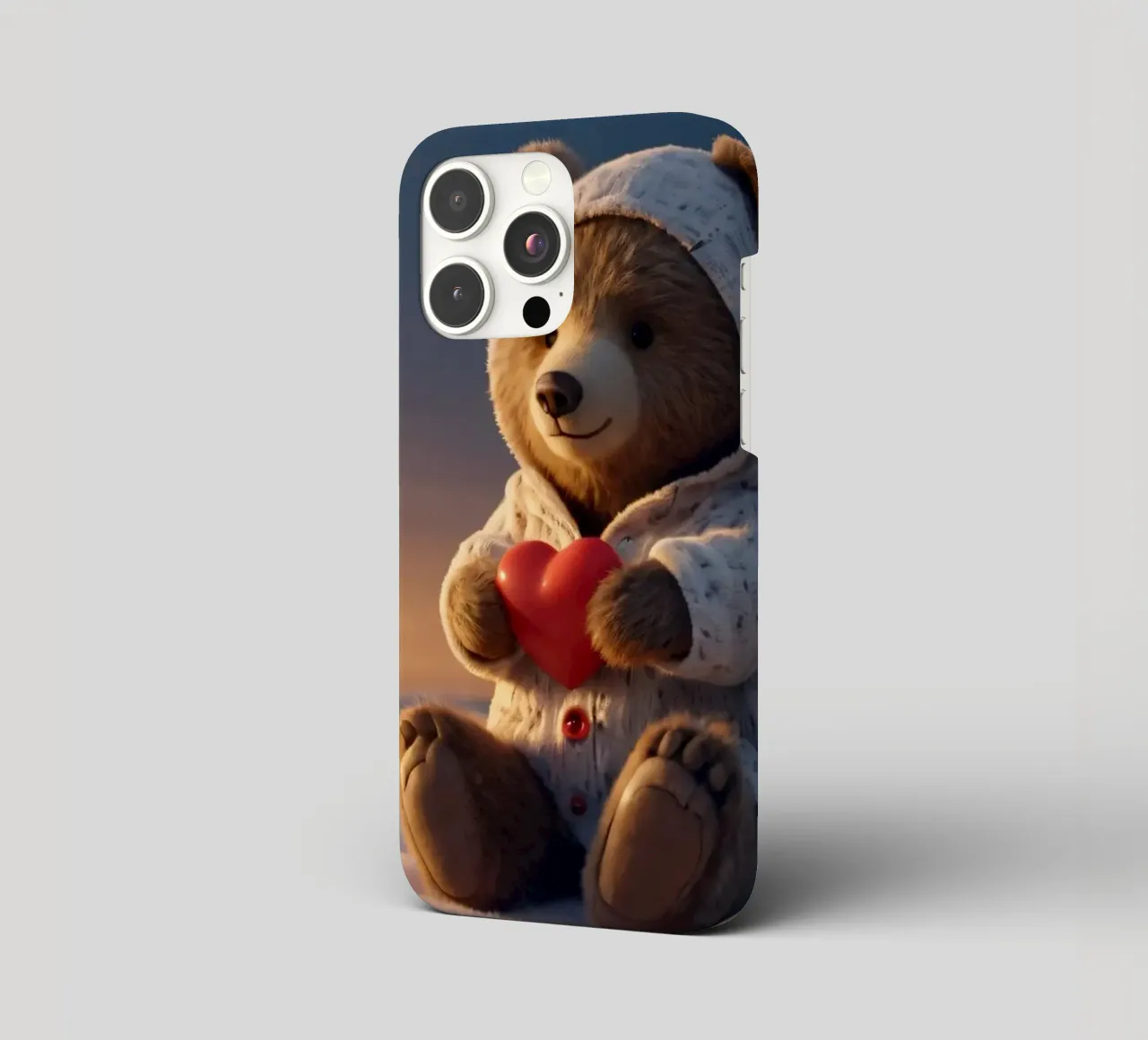 Un orsacchiotto con un'accogliente felpa con cappuccio stringe un cuore in una terra invernale cover iphone da DesignDoodle