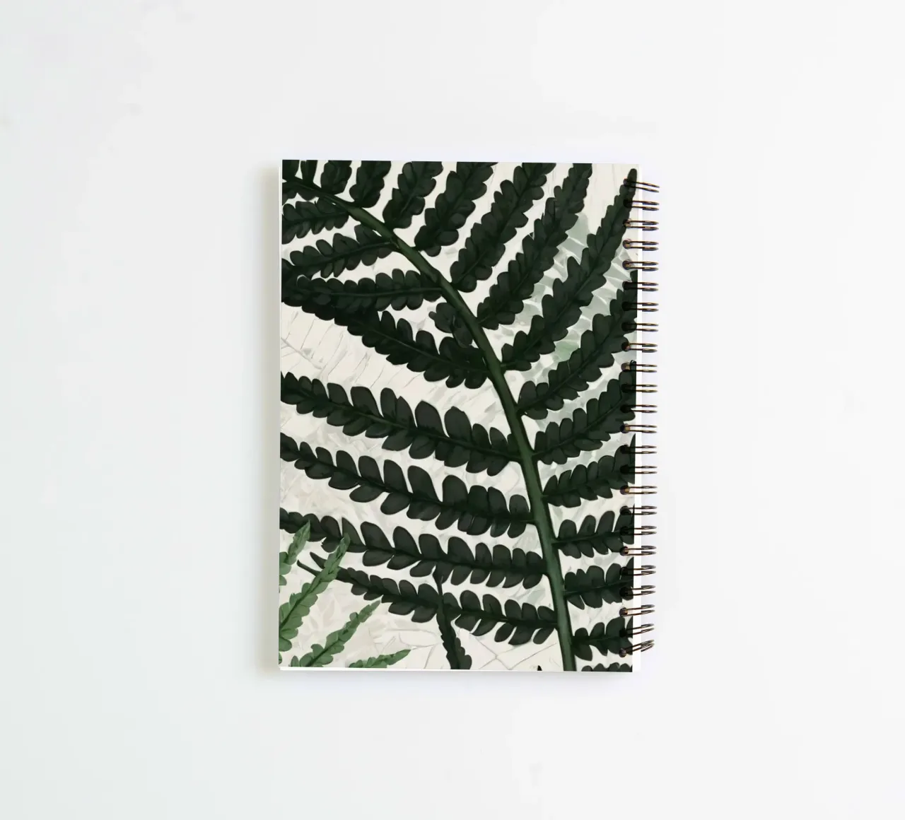 Fougères vertes luxuriantes joliment disposées sur un fond clair carnet à spirale de DesignDoodle