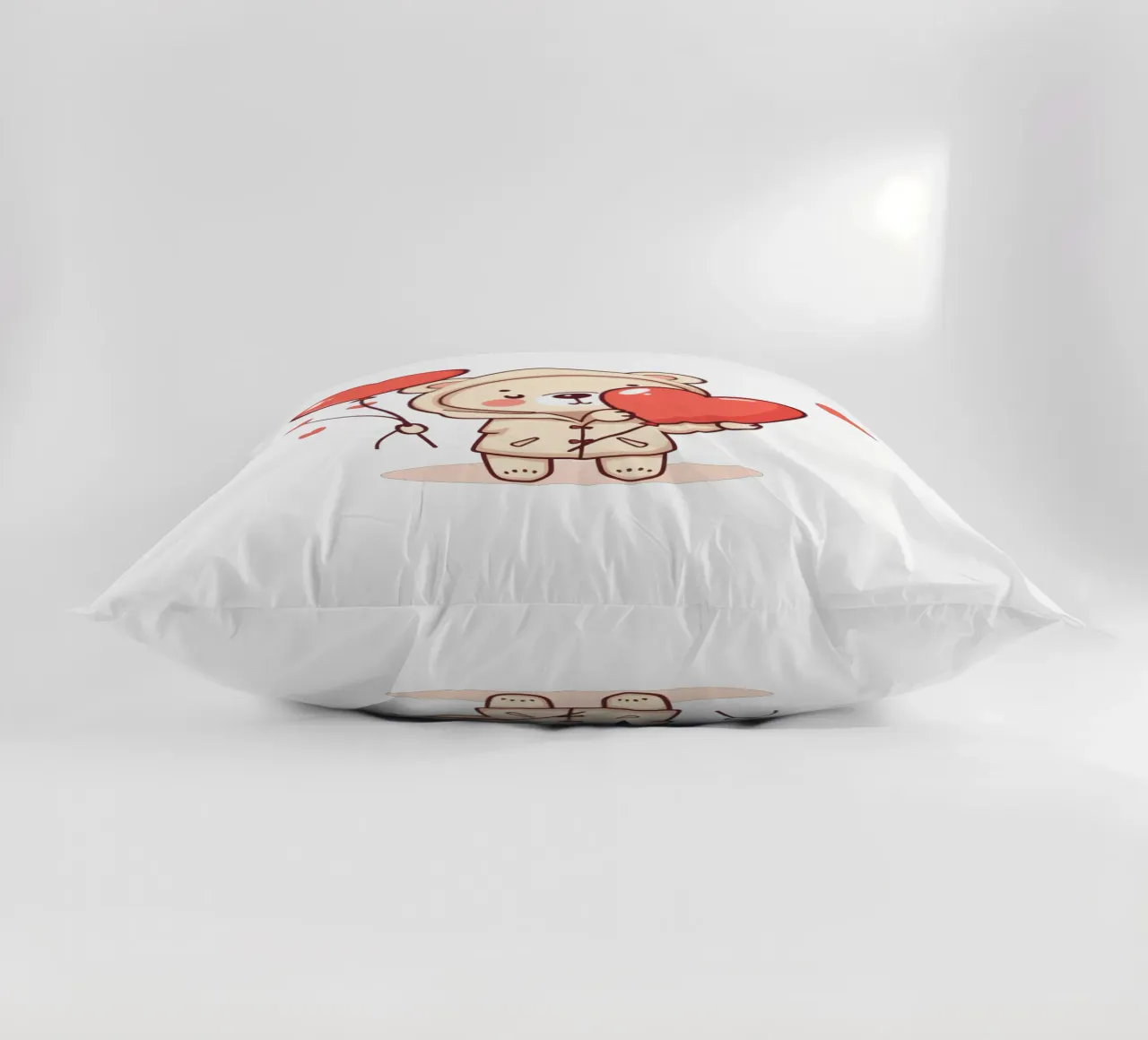 Simpatico orso che tiene in mano un cuore e dei palloncini cuscino da DesignDoodle