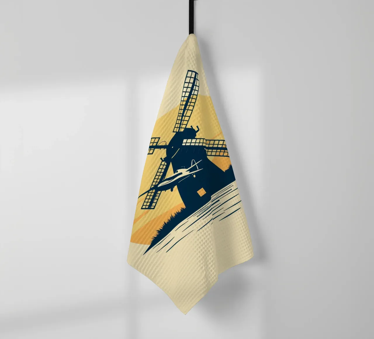 Silhouette d'un moulin à vent au coucher du soleil avec un avion en vol torchon de DesignDoodle