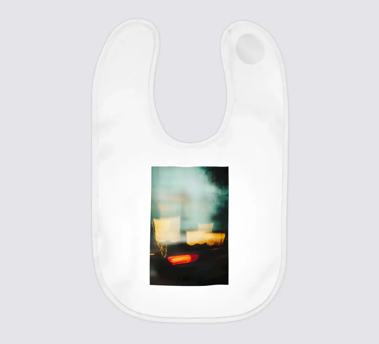 The fleeting lights of a busy street baby bib by Le Flou