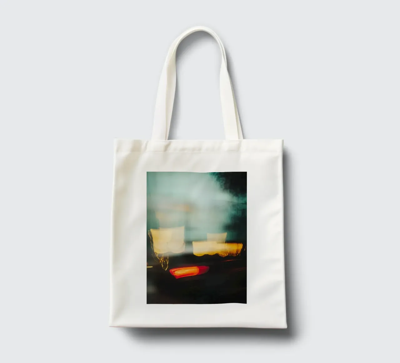 The fleeting lights of a busy street tote bag by Le Flou