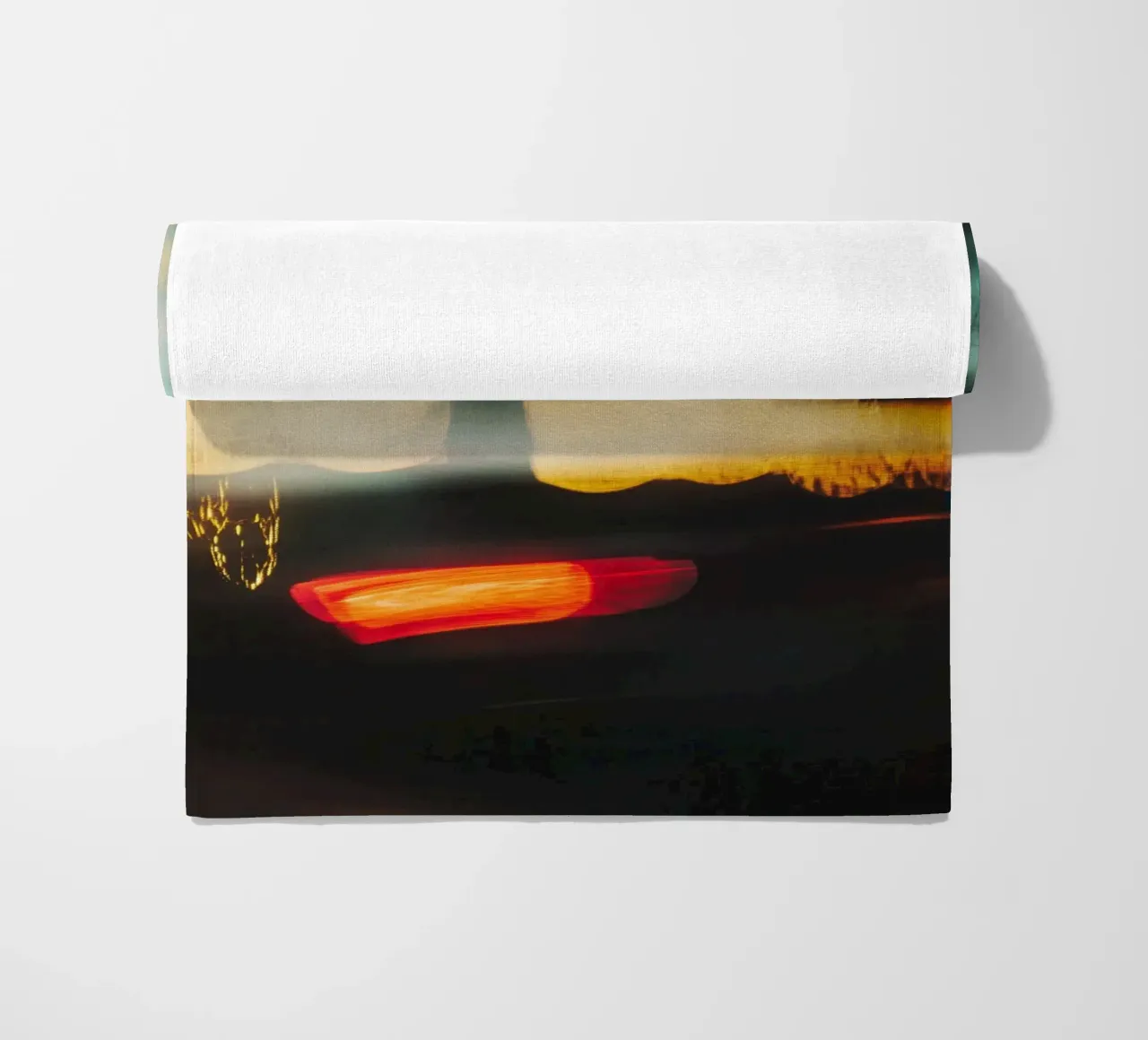 The fleeting lights of a busy street beach towel by Le Flou