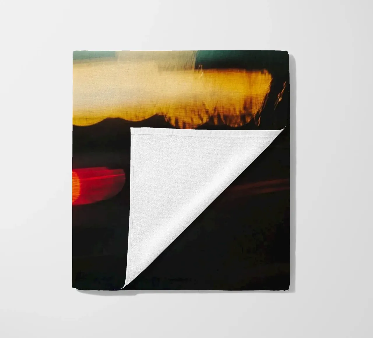 The fleeting lights of a busy street beach towel by Le Flou