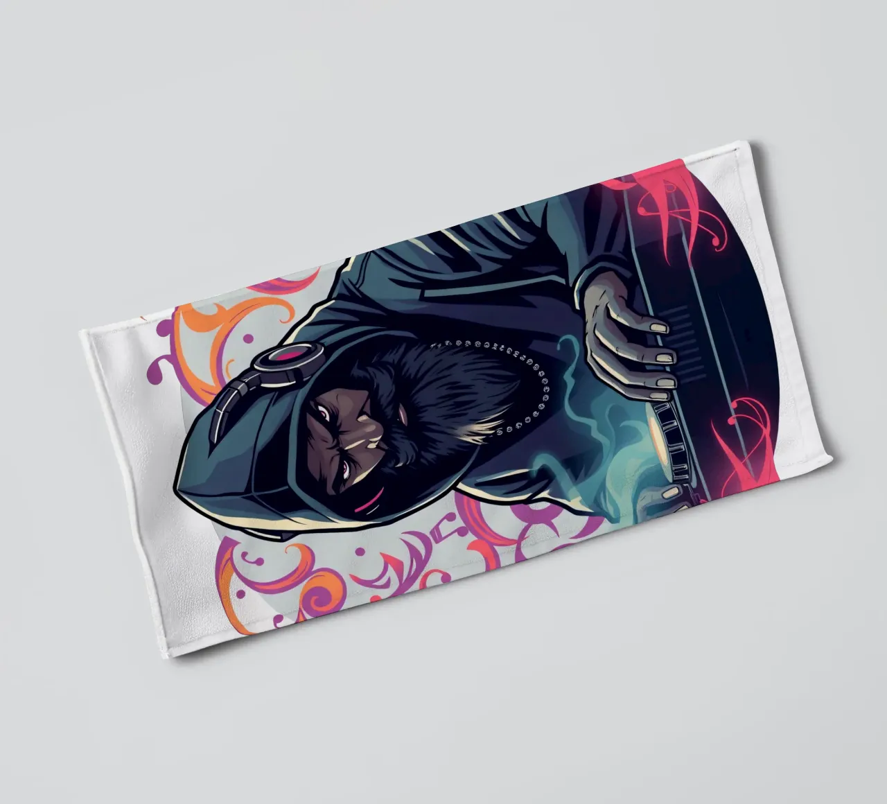 A DJ in a hoodie mixes tracks surrounded by colorful swirls towel by DesignDoodle