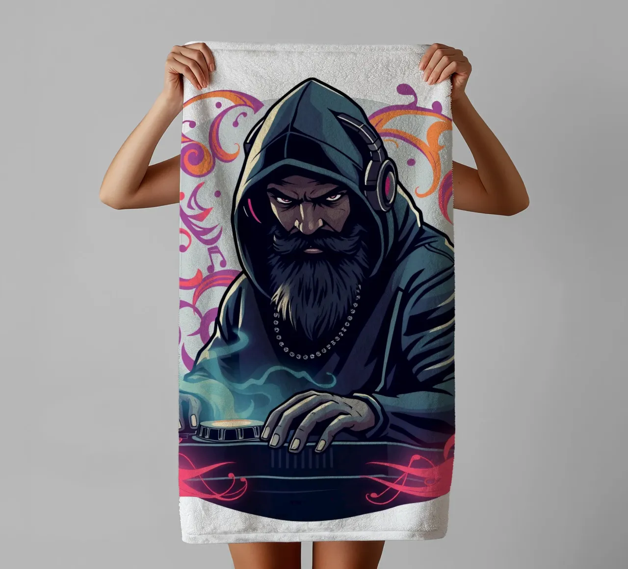 A DJ in a hoodie mixes tracks surrounded by colorful swirls towel by DesignDoodle