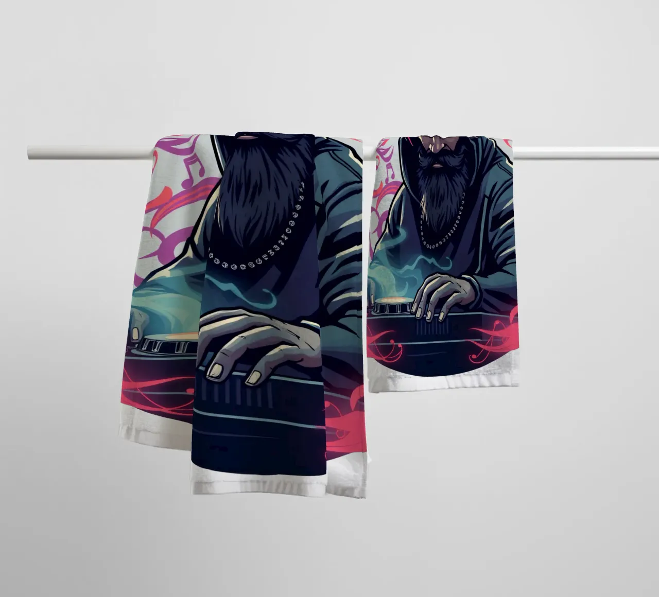 A DJ in a hoodie mixes tracks surrounded by colorful swirls towel by DesignDoodle