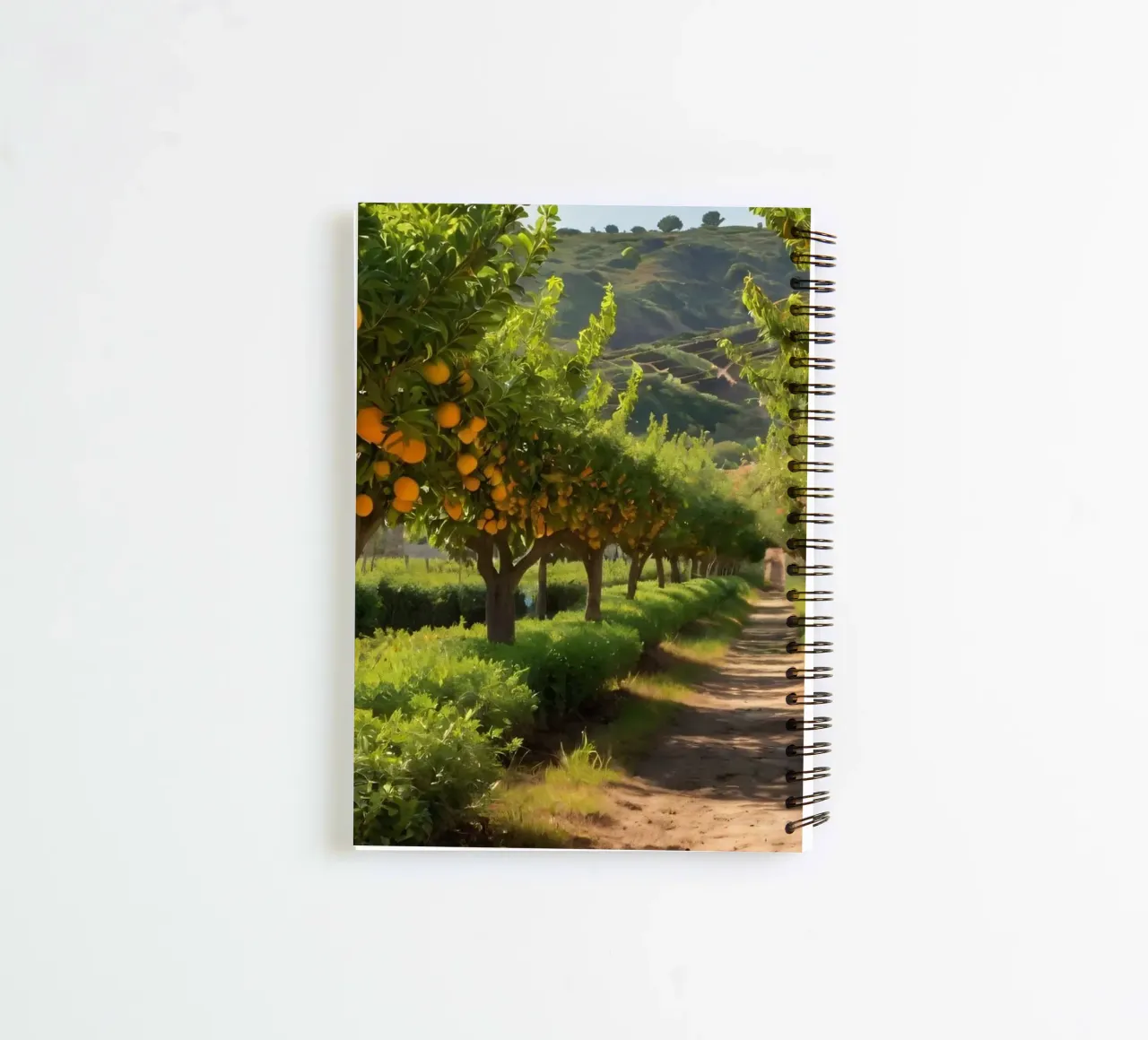 orange grove with lush trees and a sunlit pathway spiral notebook by DesignDoodle