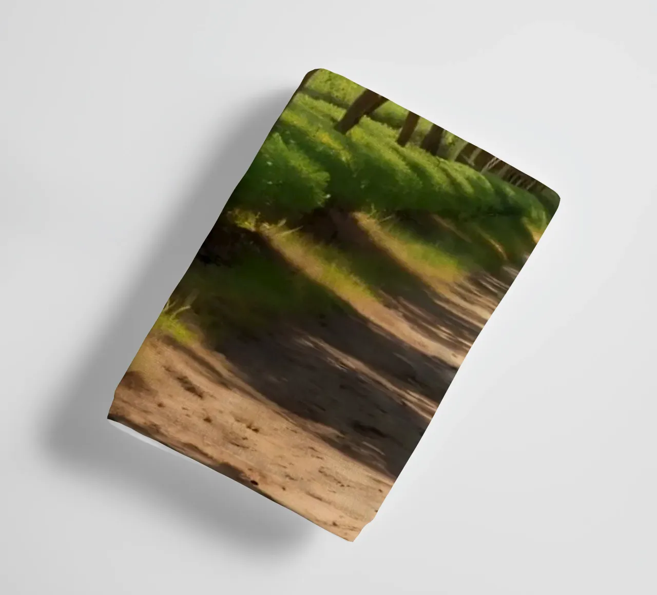 orange grove with lush trees and a sunlit pathway towel by DesignDoodle