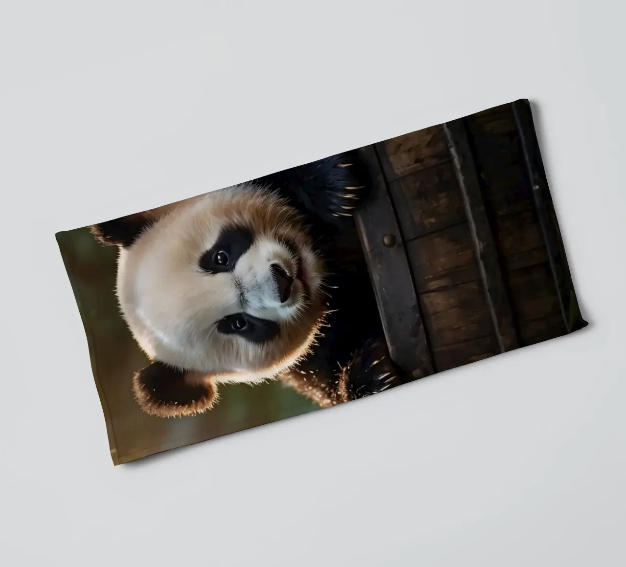 Un cucciolo di panda gioca a esplorare un barile di legno in una stanza illuminata dal sole. asciugamano da bagno da DesignDoodle