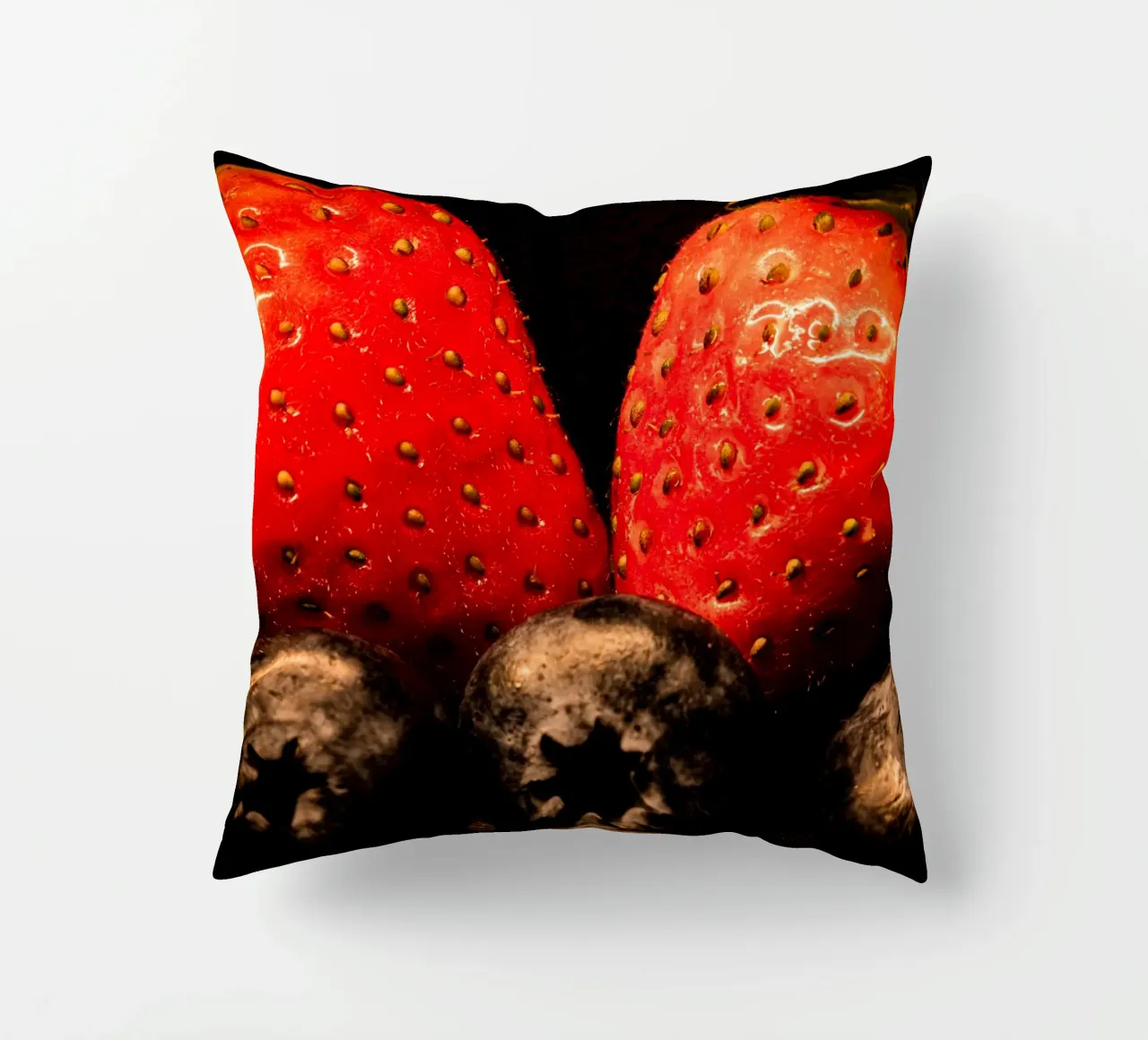 Strawberries and blueberries against a black background decorative cushion by Marcus Beckert | Fotografie