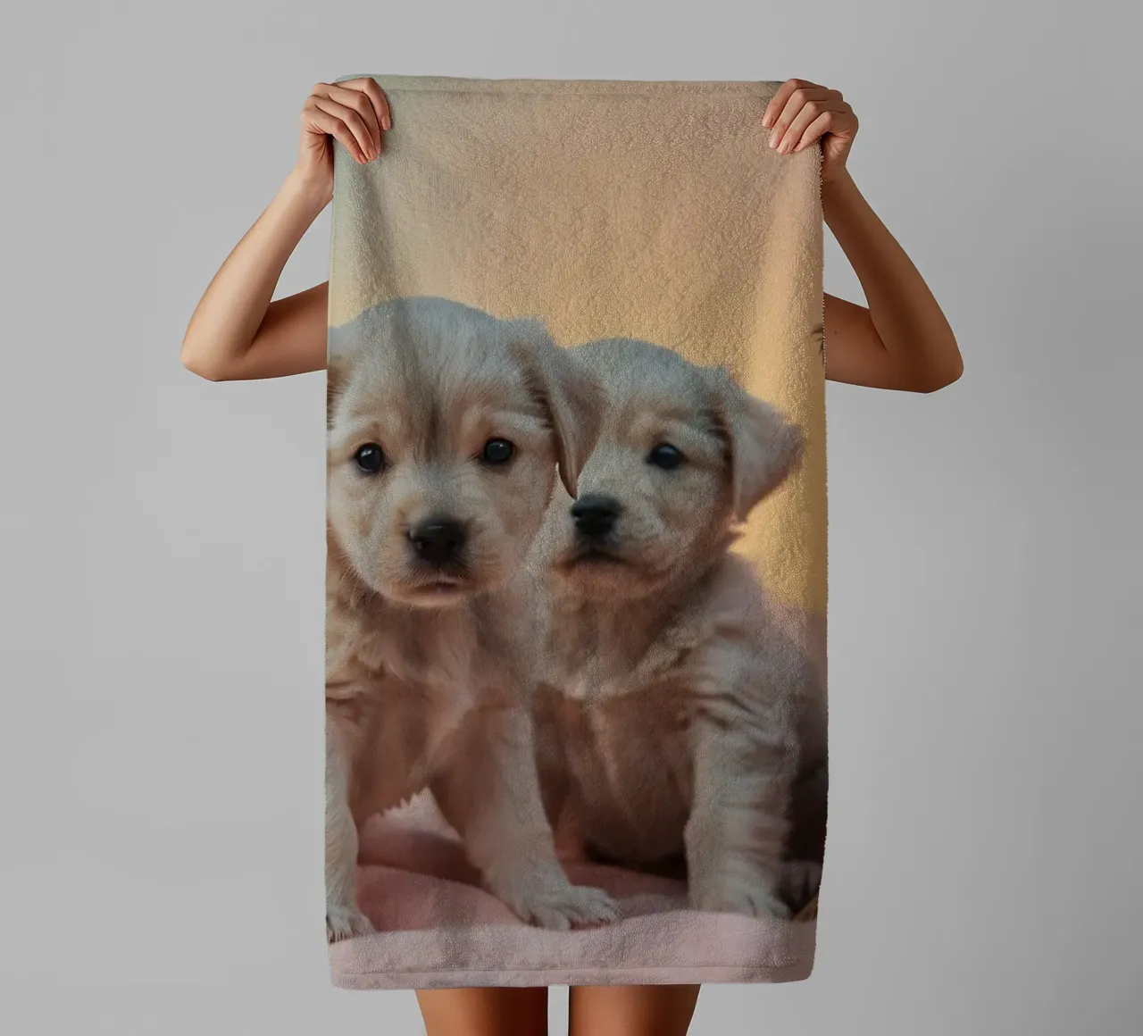 Three playful puppies resting on a soft blanket in cozy room towel by DesignDoodle