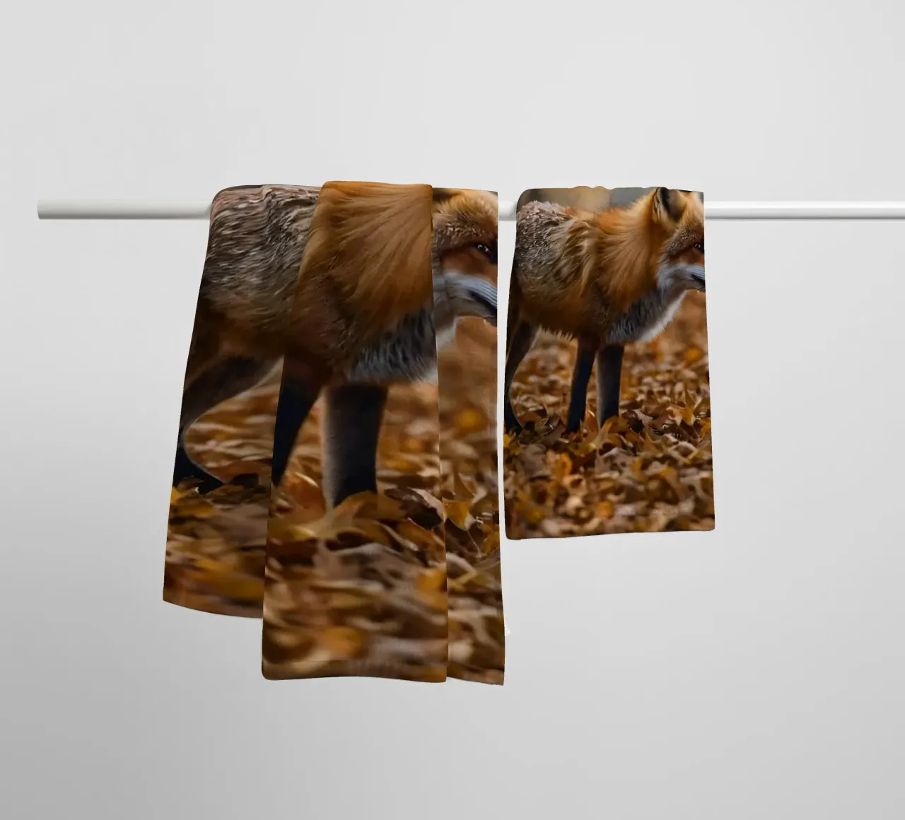 Fox gracefully walks through forest covered autumn leaves towel by DesignDoodle