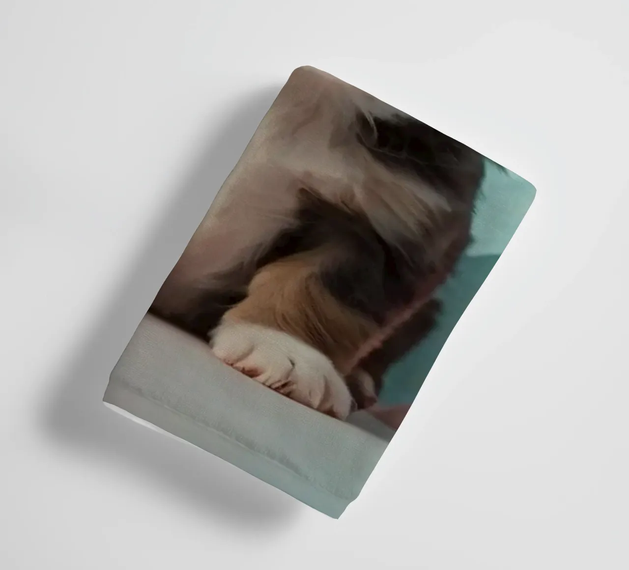 Cute puppy sitting between pastel-colored rocks towel by DesignDoodle