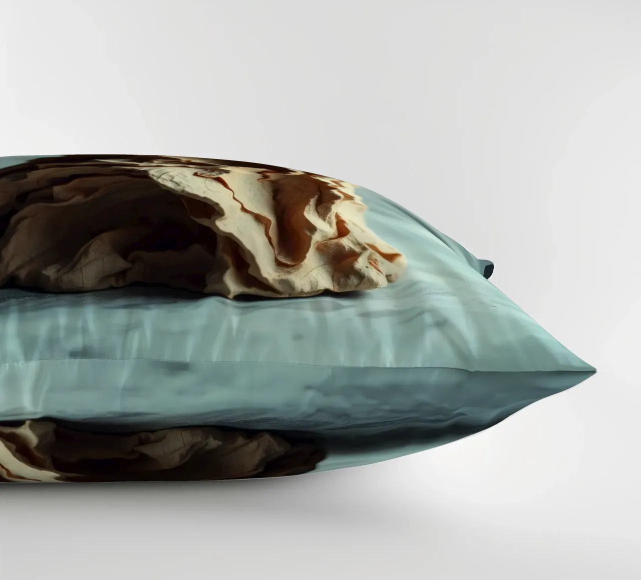 Unique textured sculpture displayed against a soft gray decorative cushion by DesignDoodle