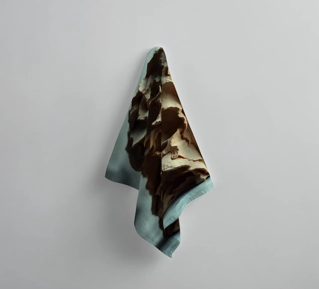 Unique textured sculpture displayed against a soft gray towel by DesignDoodle