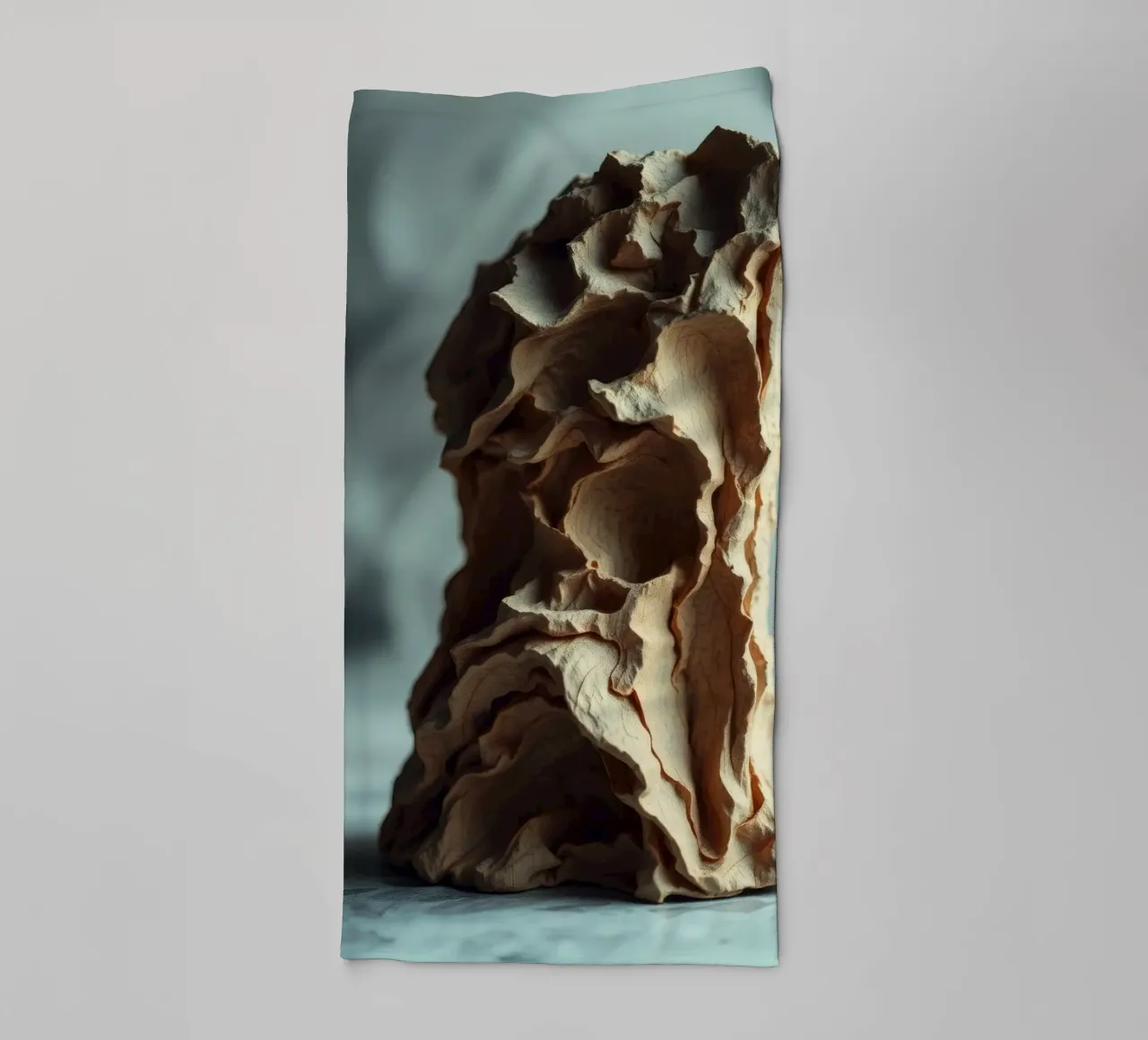 Unique textured sculpture displayed against a soft gray towel by DesignDoodle