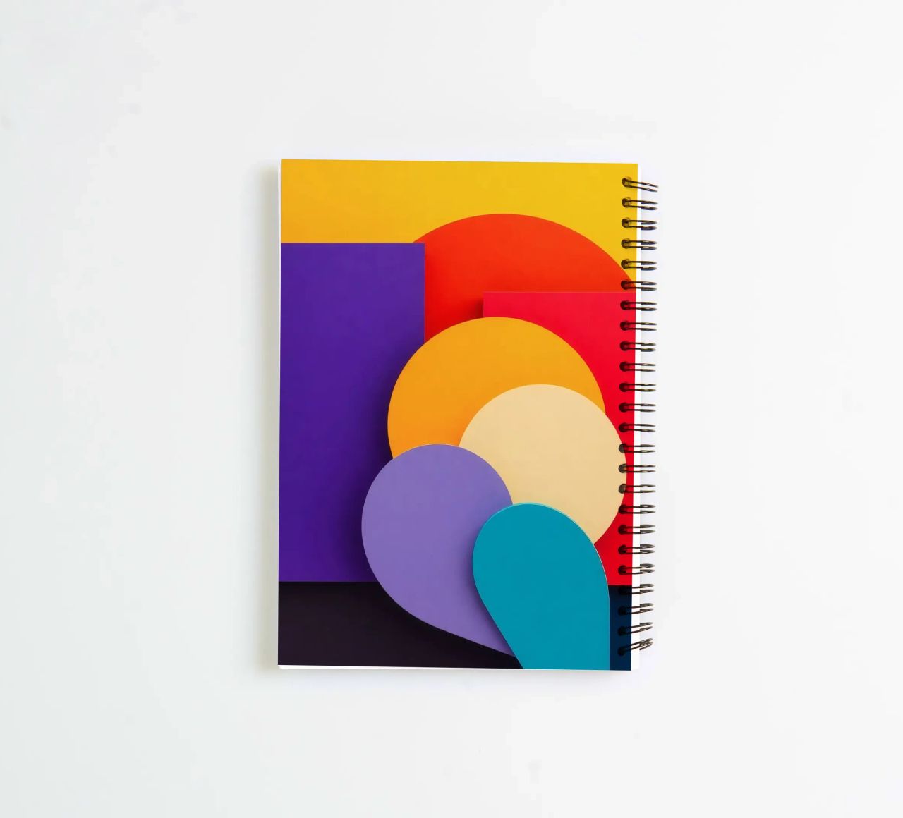 Colorful geometric shapes create an abstract design spiral notebook by DesignDoodle