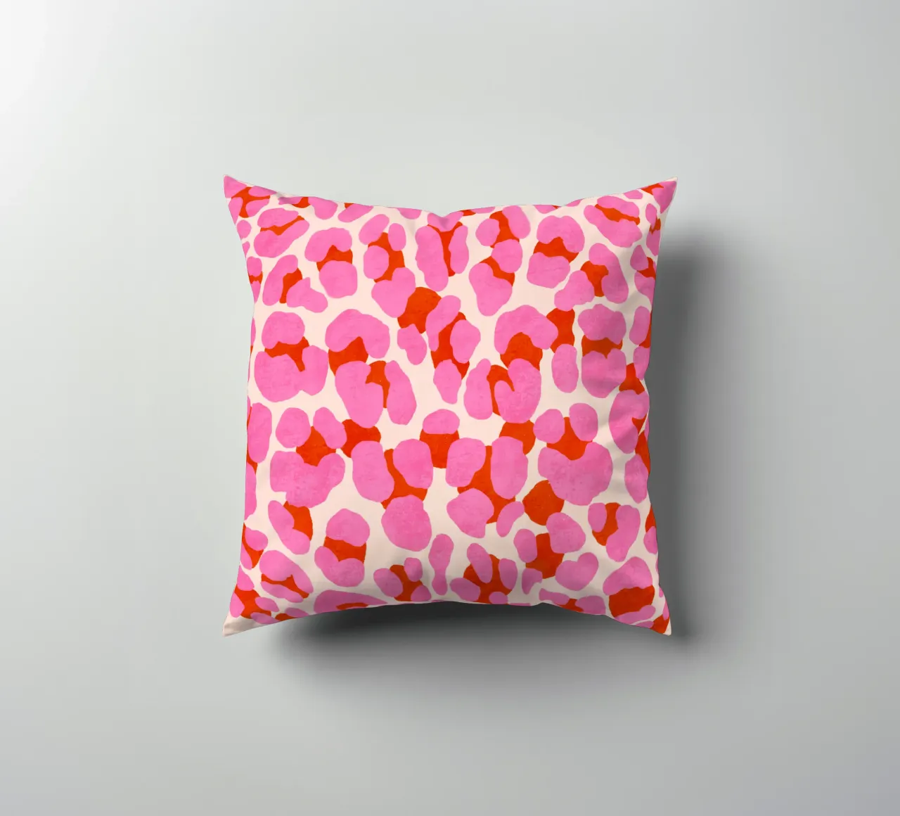 Leopard pattern. Modern in pink, red and abricot. With heart. decorative cushion by CalliLetters
