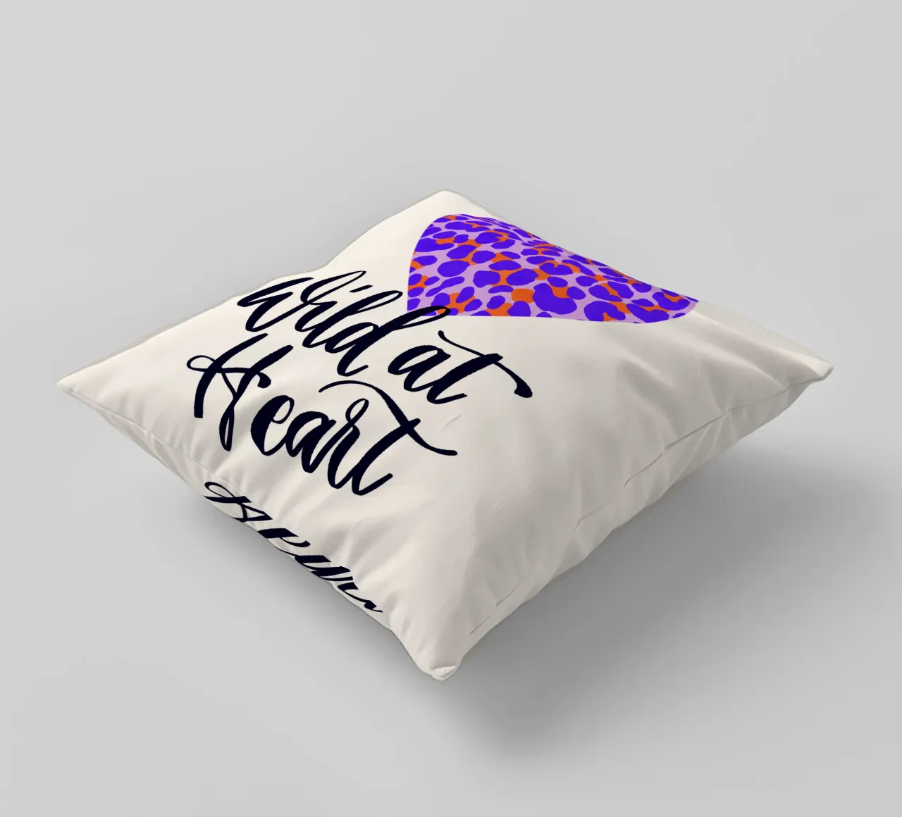 Wild at Heart. Brush calligraphy with leo print pattern decorative cushion by CalliLetters