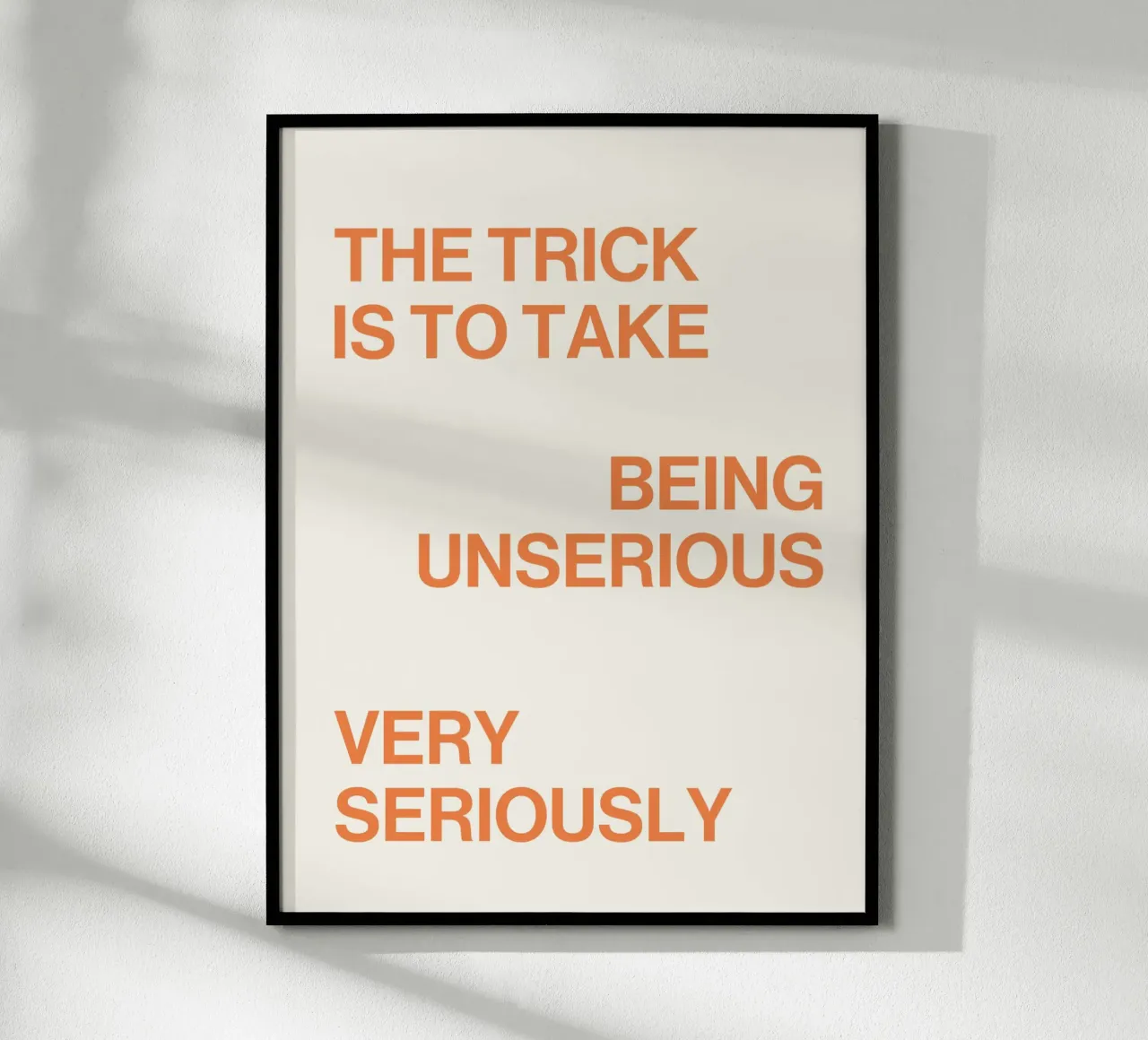 The trick is to take being unserious very seriously quote poster with wooden frame by Paigaam Studio