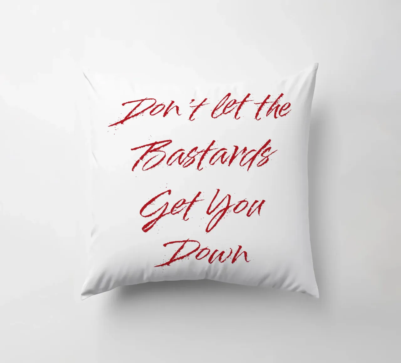 'Don't Let The Bastards Get You Down' - Red Text decorative cushion by FABOArt
