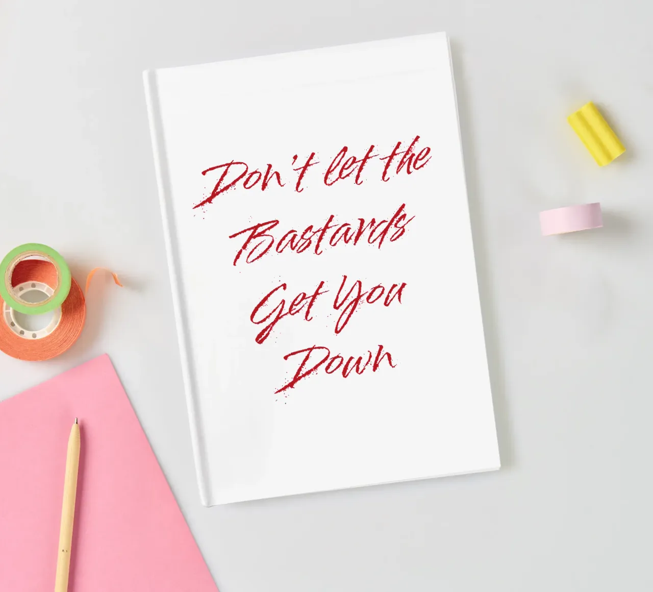 'Don't Let The Bastards Get You Down' - Red Text notebook by FABOArt