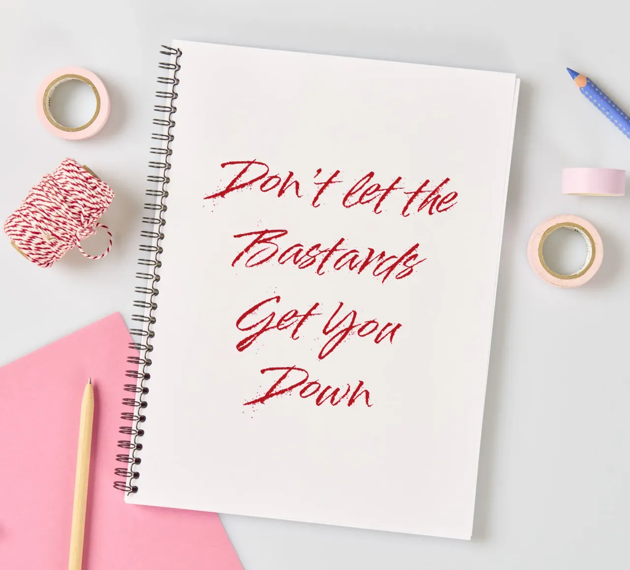 'Don't Let The Bastards Get You Down' - Red Text spiral notebook by FABOArt