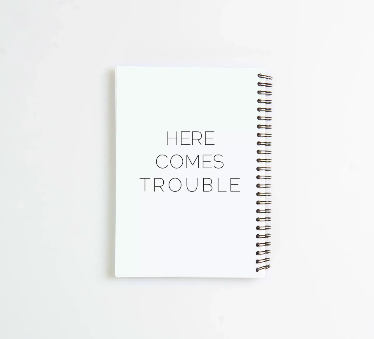 Trouble spiral notebook by Leah Flores