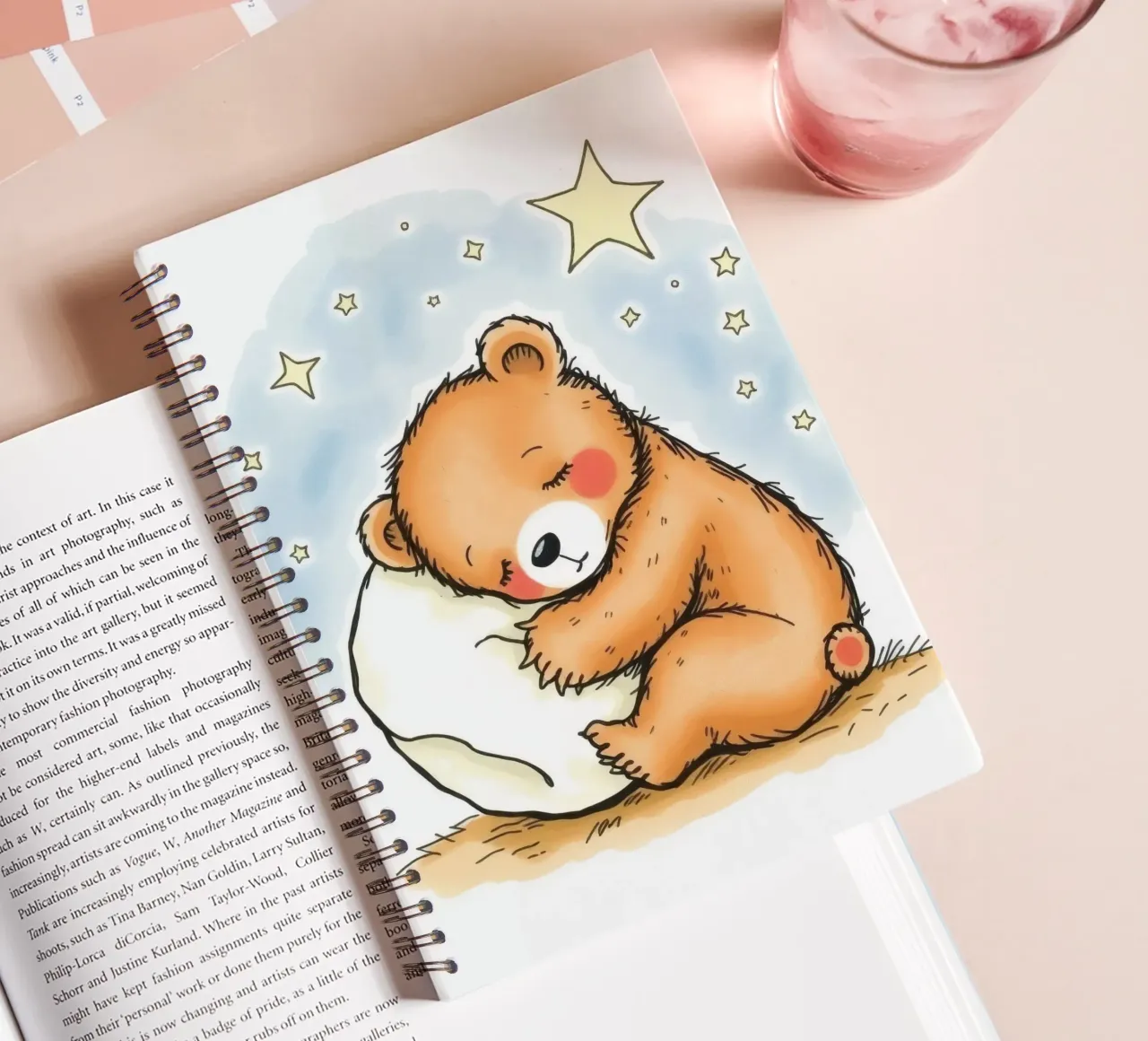 Cute bear cuddling a pillow under stars in a night sky spiral notebook by DesignDoodle
