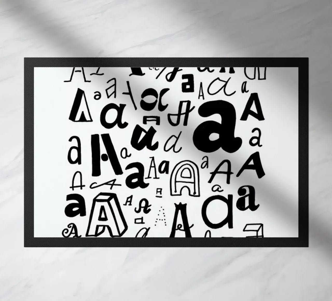 Aa deurmat van petiteCAPS