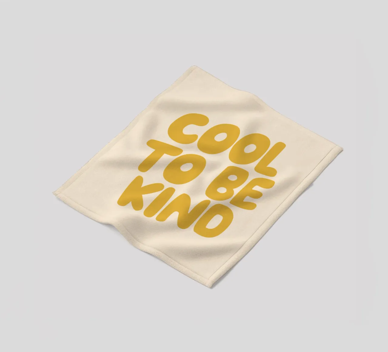 Design tipografico Cool to Be Kind in giallo coperta in pile da THE MOTIVATED TYPE