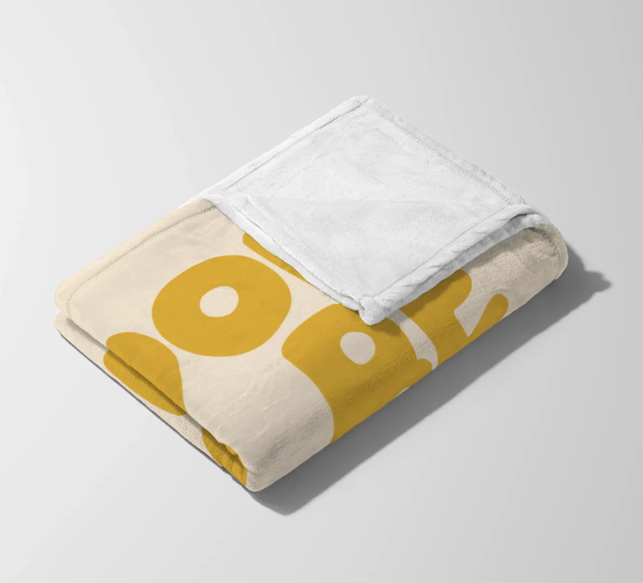 Design tipografico Cool to Be Kind in giallo coperta in pile da THE MOTIVATED TYPE
