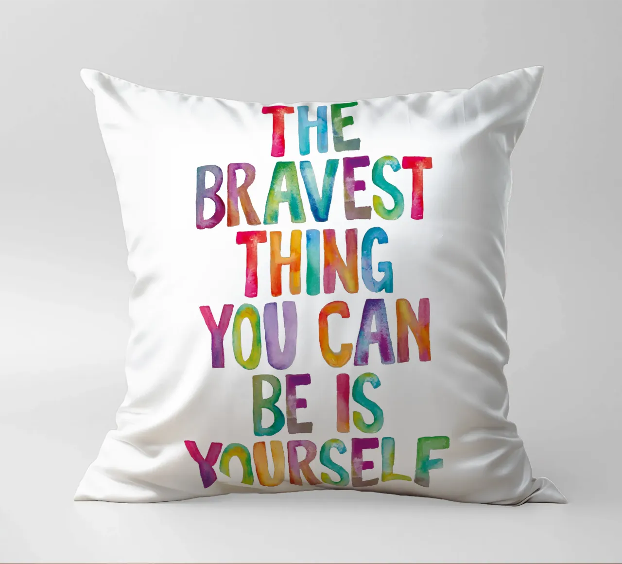 The Bravest Thing You Can Be is Yourself Rainbow Typography decorative cushion by THE MOTIVATED TYPE