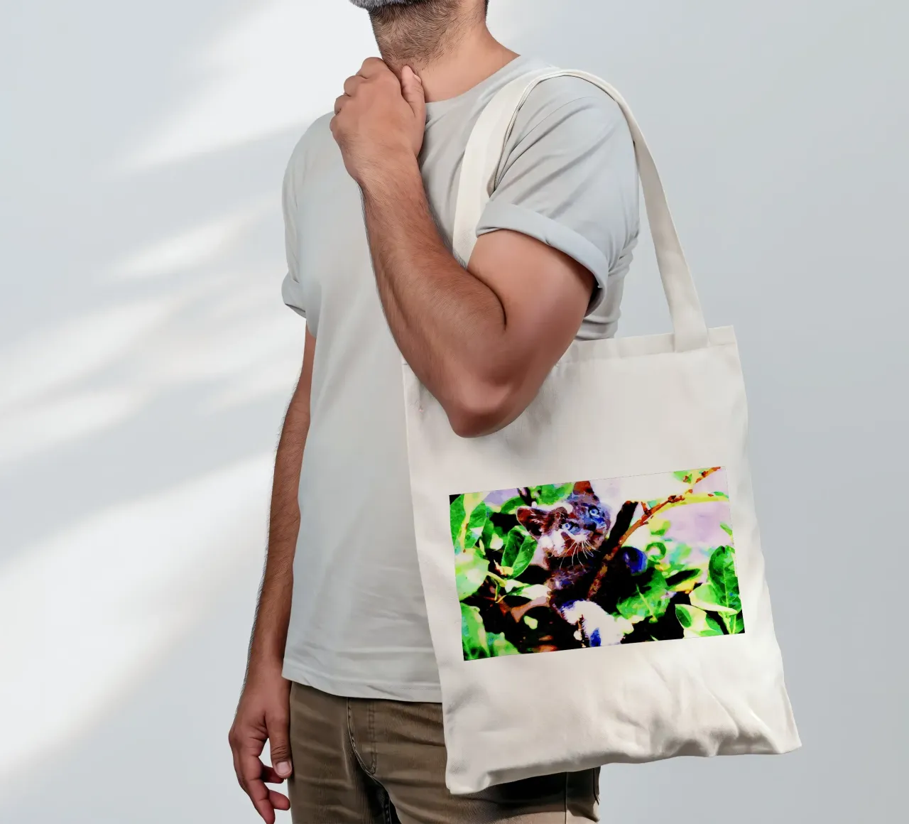Kitten in the green tote bag by Massimo Frascogna