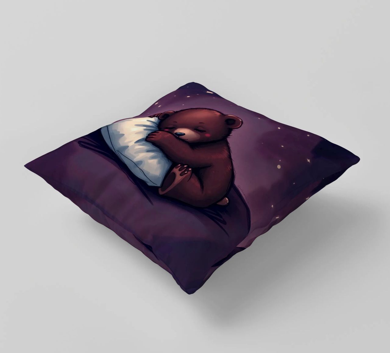 Un mignon ours brun câline un oreiller sous un ciel étoilé coussin de DesignDoodle