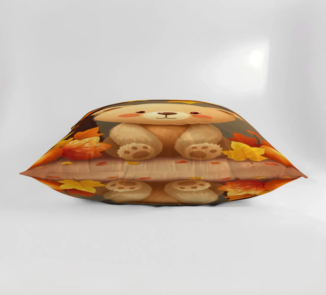 Un simpatico orso siede tra foglie e zucche colorate d'autunno cuscino da DesignDoodle