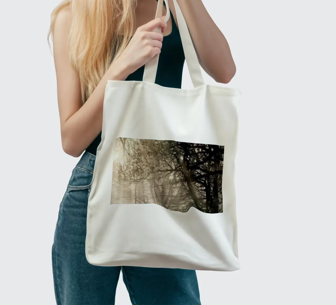 An image of a beautiful tree in the fog in the forest tote bag de anderm
