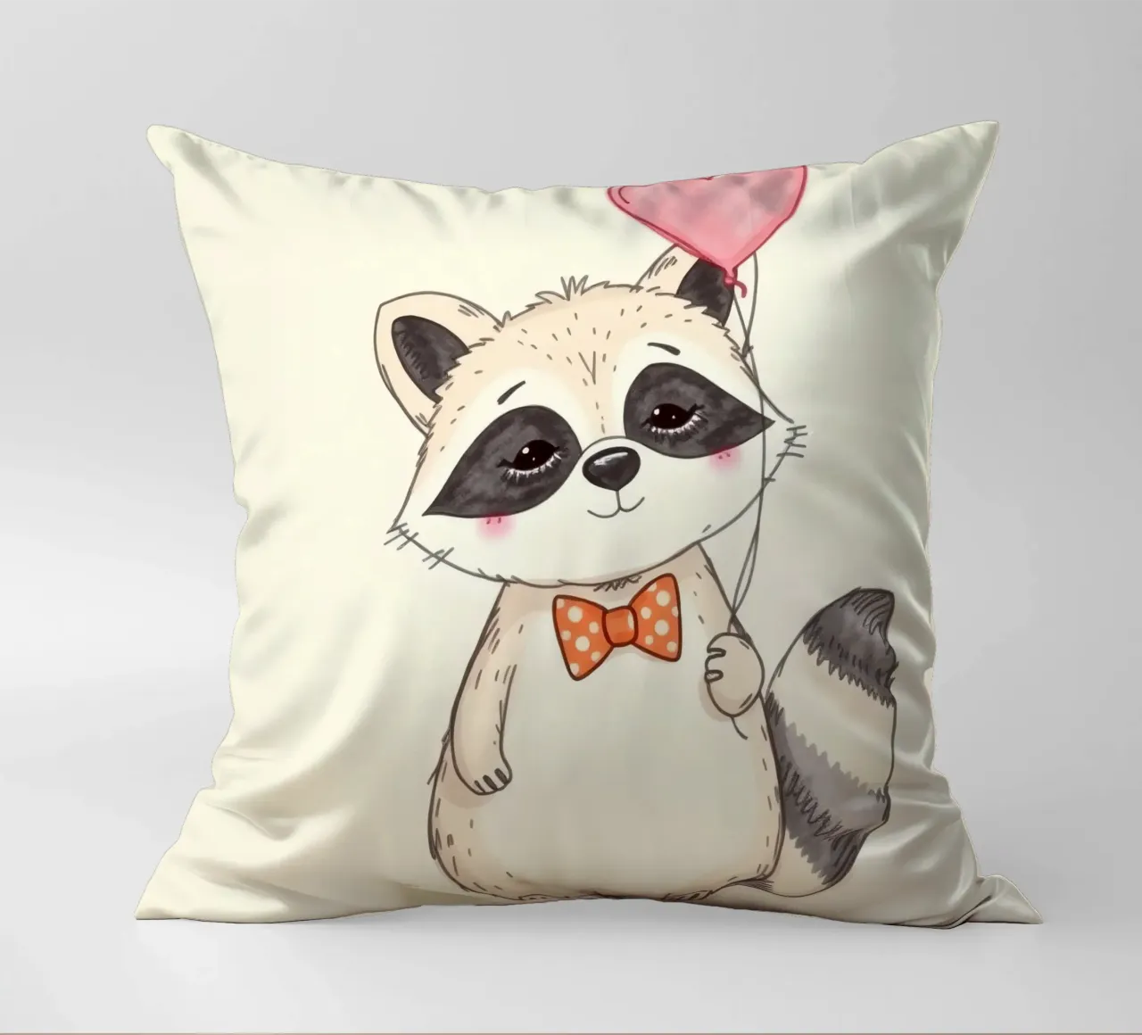 Simpatico procione che tiene in mano un palloncino a forma di cuore e indossa un papillon cuscino da DesignDoodle