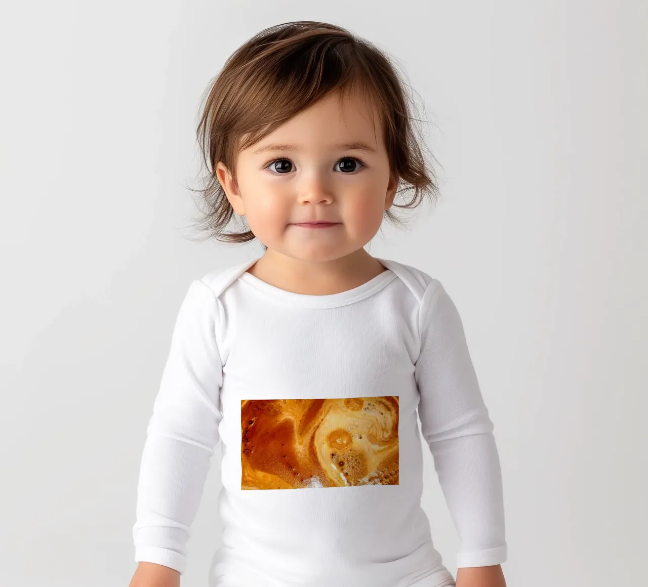 My cappuccino long-sleeve baby romper by Massimo Frascogna