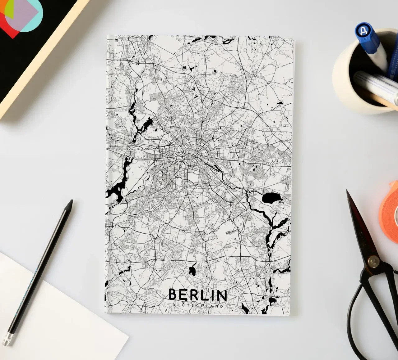 Berlin map white notebook by Christopher Adams