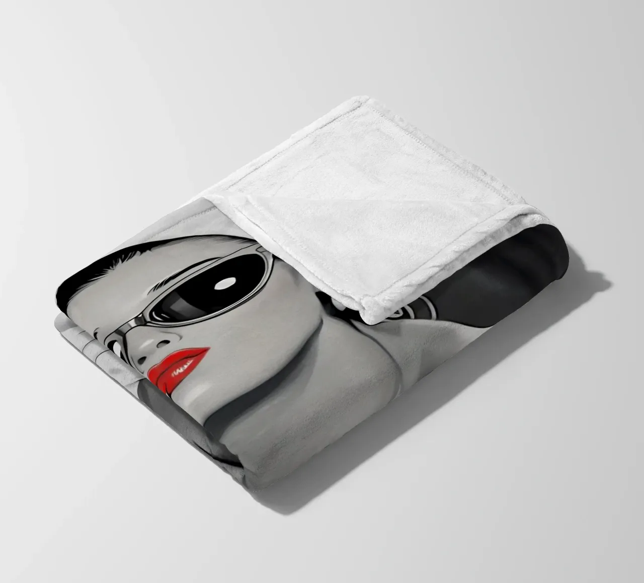 AUDREY HEPBURN PUTTING ON LIPSTICK fleece blanket by ARTOMATIC