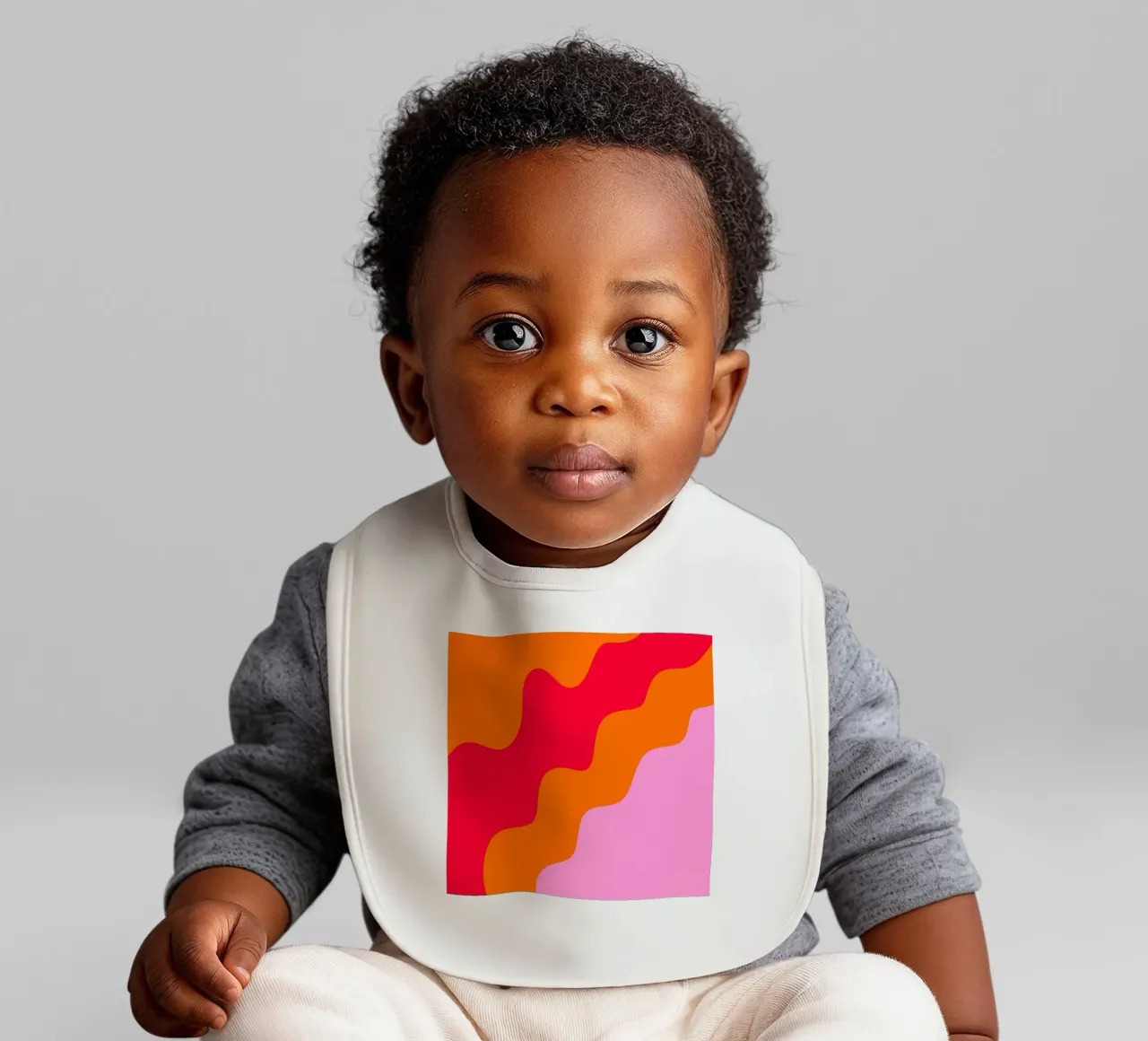 Forme ondulate in color blocking rosa, rosso, arancione bavaglino da Wackapacka