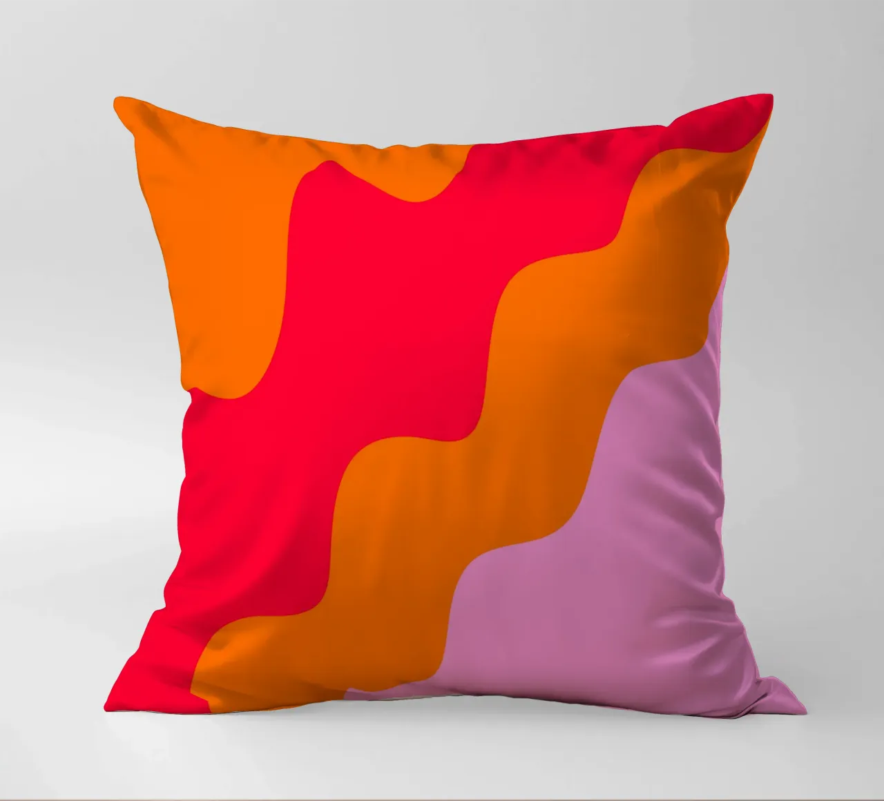 Color blocking wavy shapes pink, red, orange decorative cushion by Wackapacka